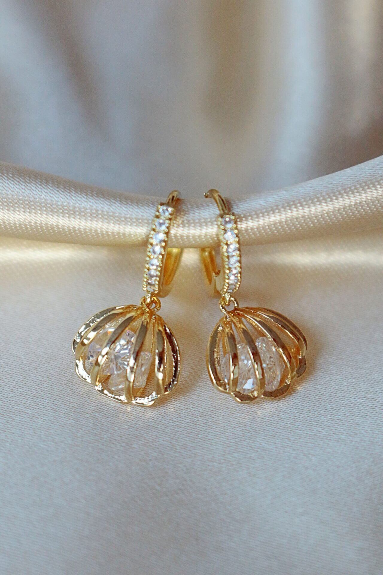 https://goldenpearlcharms.com/products/zel-24k-gold-seashell-cubic-zirconia-hoops/data_81724c4e-8e41-41d6-9d46-02b1b63f4825