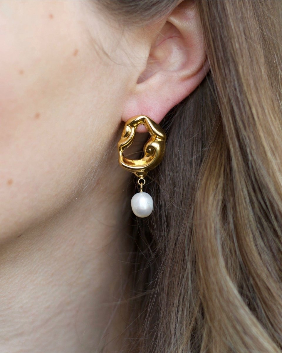 Close-Up Side View of Araceli Gold Hoops with Pearls Worn on Model’s Ear