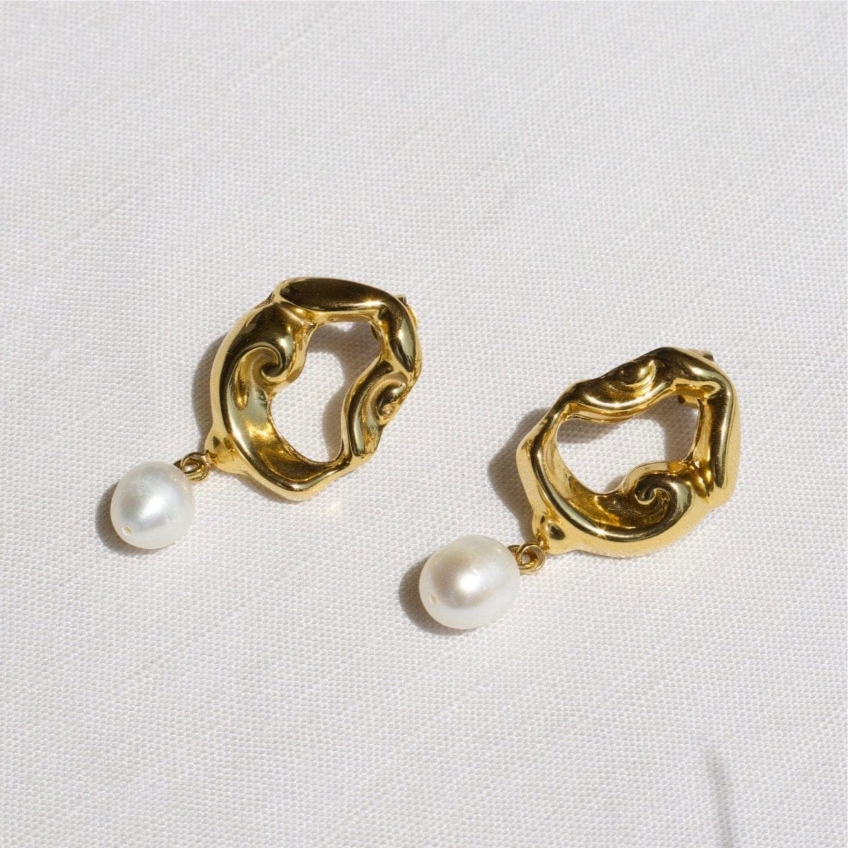 Close-Up of Araceli Gold Hoops Showing Yellow Gold PVD Coating and Baroque Studs