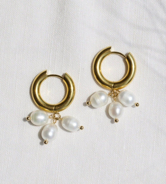 Ceci Gold Hoop Triple Cluster Pearl Earrings on White Cloth