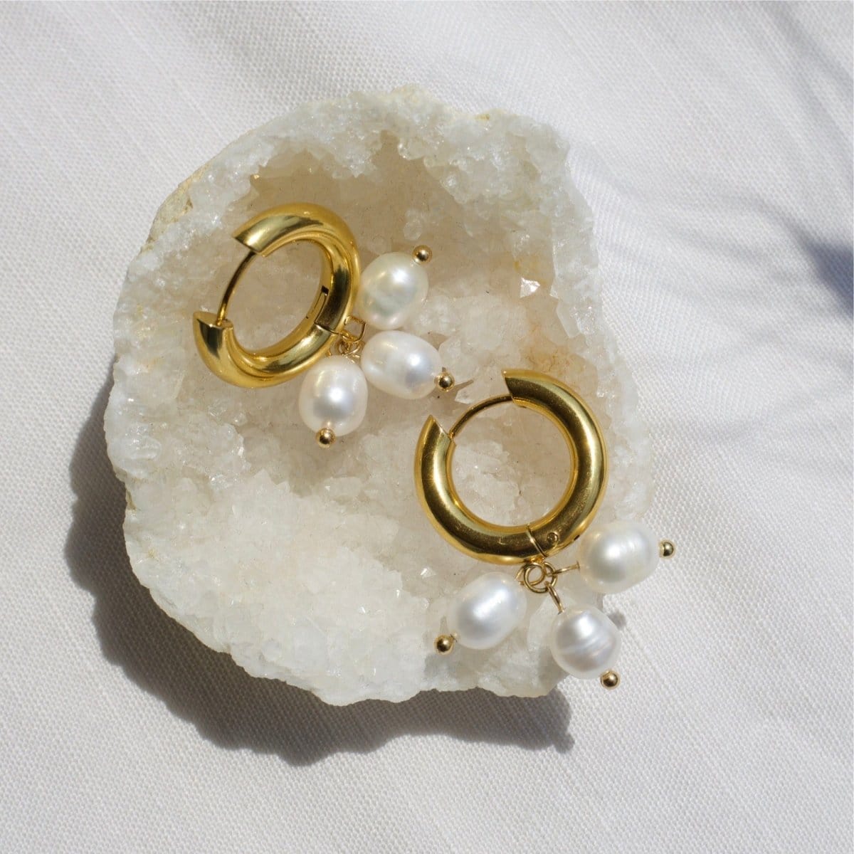 Ceci Gold Hoop Triple Cluster Pearl Earrings on White Shell